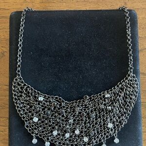 Silver and White Bib Necklace with Intricate Metalwork